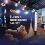 A group of people standing in a train station