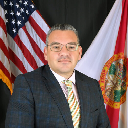 A man wearing a suit and tie
