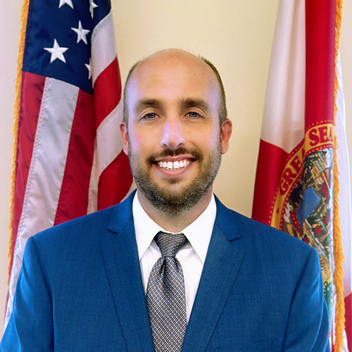 A man wearing a suit and tie