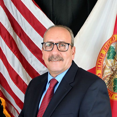 A man wearing a suit and tie