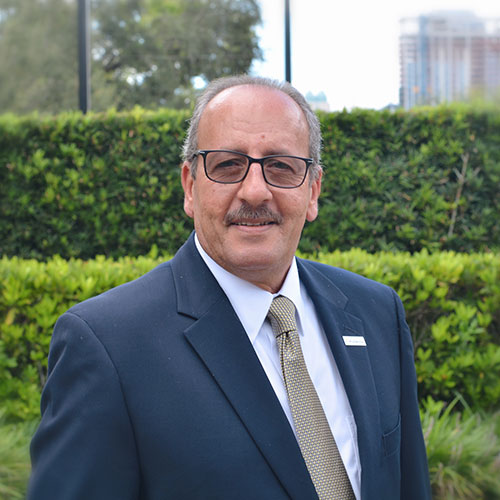 A man wearing a suit and tie