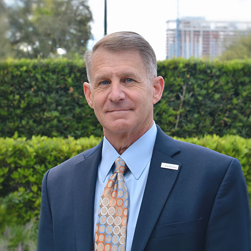 A man wearing a suit and tie